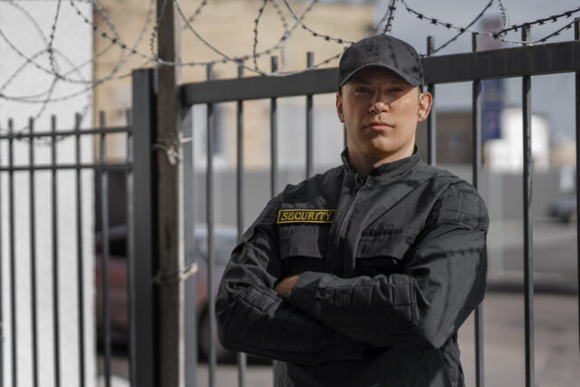 Armed security guard protecting a high-risk business location