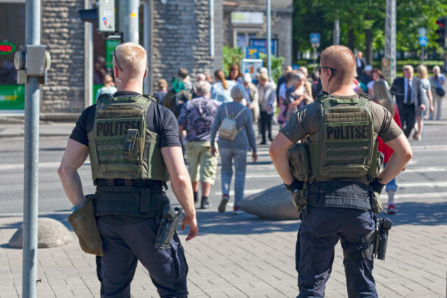 Armed security guards providing protection at crowded place Armed security guards providing protection at crowded place