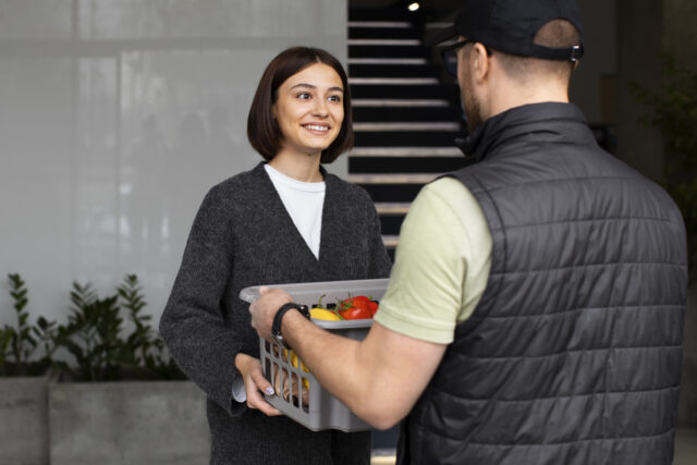 Security officer helping a customer in a retail store aisle. Security officer helping a customer in a retail store aisle.